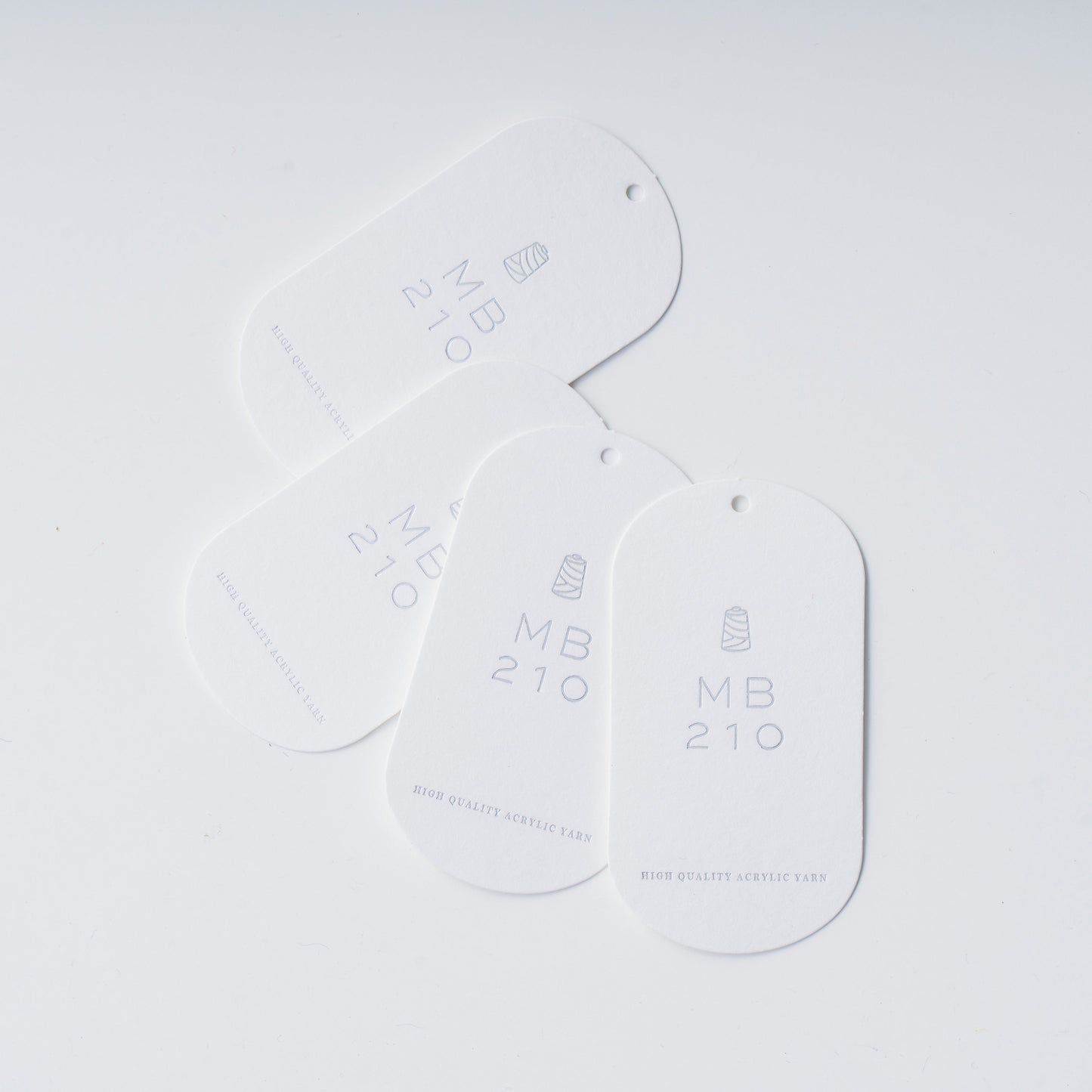 MB210の購入1回ごとに1枚付いてくる、製作頂いた作品に取り付け、MB210の糸の使用を証明するタグ