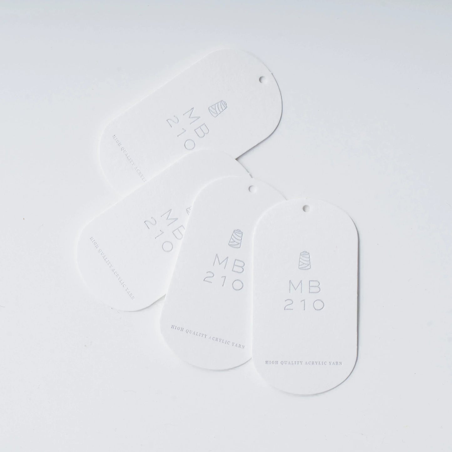 MB210の購入1回ごとに1枚付いてくる、製作頂いた作品に取り付け、MB210の糸の使用を証明するタグ