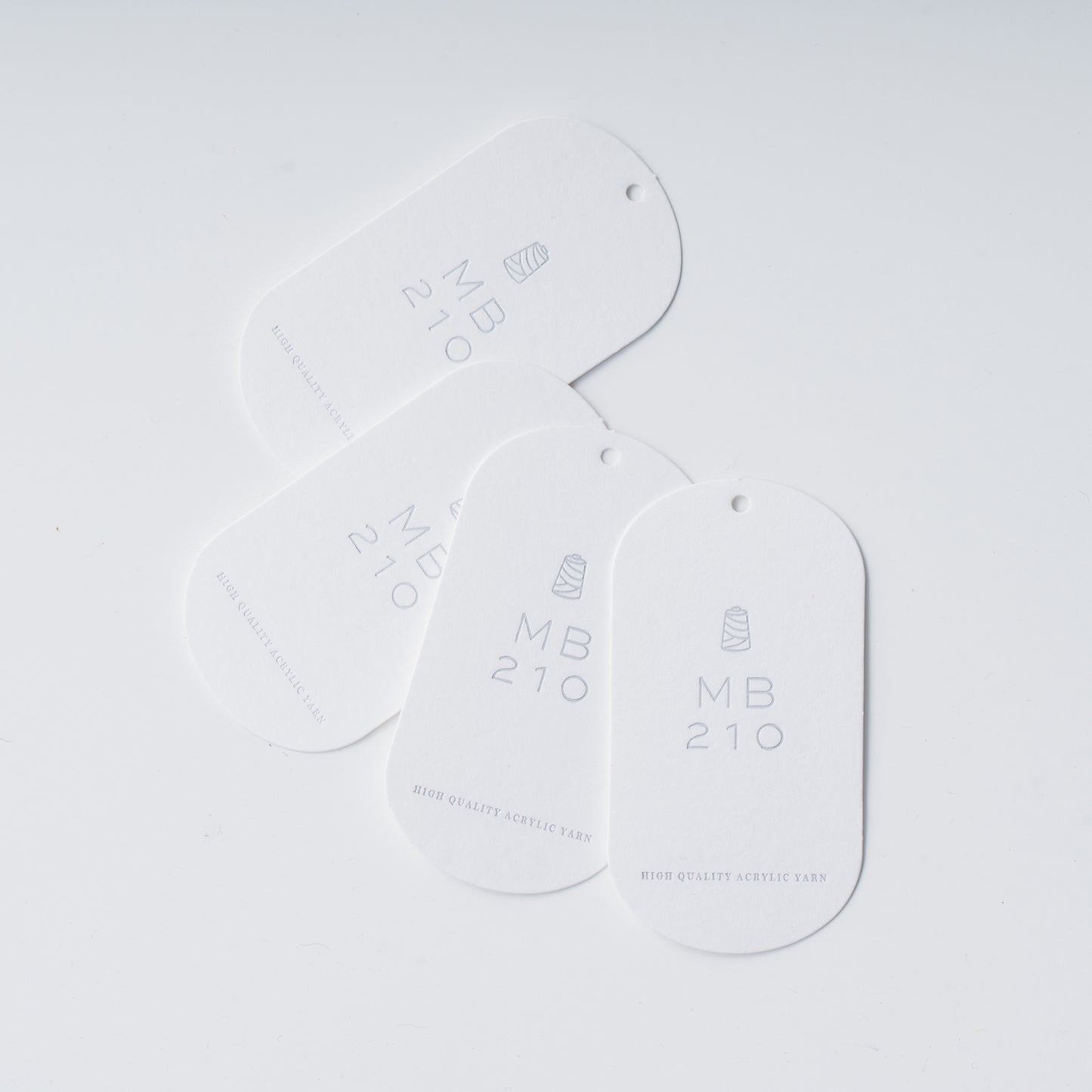 MB210の購入1回ごとに1枚付いてくる、製作頂いた作品に取り付け、MB210の糸の使用を証明するタグ